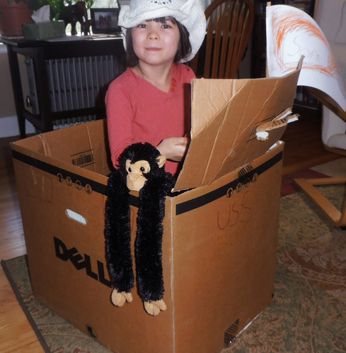 Sofie and Rizzo in her recycled boat.
